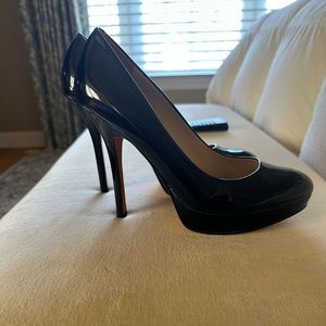 Joan and David black patent platform heels